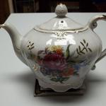 Vintage Hand Painted Porcelain Teapot Music Box.  Very unusual piece.  Made in Japan & has gold trim.  Plays "Tea for Two".  Pre-owned & in excellent condition.  $35.00 obo