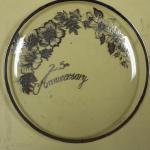 25th Anniversary Silver Painted Glass Plate.  Measures 12" in diameter.  Pre-owned & in great condition.  $22.00 obo