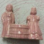 Vintage Pink Boy/Girl Planter.  Adorable with basket in middle for plant.  Pre-owned & in excellent condition.  $15.00 obo