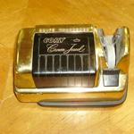 Vintage Cory Crown Jewel Electric Knife Sharpener.  Finished in gold with black accents.  Measures 6" long.  Pre-owned & in great condition, very elegant looking.  $20.00 obo