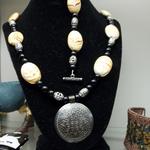 African Tan Stone & Black Bead Necklace & Bracelet.  Necklace has beautiful detailed metal medallion.  Measures 24"l.  Bracelet measures 8"l.  Pre-owned & in excellent condition.  $60.00 for the set obo