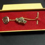 Vintage Ford Tie Tack.  Has the Ford Emblem attached to a Ford truck with chain.  Believe this to be gold filled.  Pre-owned & in excellent condition, includes original box.  $15.00 obo