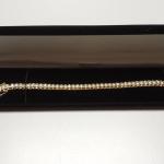 Gold Overlay Sterling Silver with Cubic Zirconia Tennis Bracelet.  Gorgeous.  Has 2 safety latches on each side.  Measures 8" in length.  Pre-owned & in excellent condition.  $89.00 obo