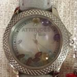 Attitude by Rene Watch.  Has multi Gemstones inside and a leather band.  Pre-owned & in excellent condition.  $75.00 obo