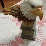 Resin Eagle Head on Pedestal.  Great piece.  Measures 10 x 14.  Pre-owned & in great condition, has a chip on bottom of pedestal.  $40.00 obo