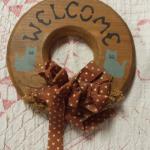 Wood Welcome Wreath by Earthtone Original Inc.  Measures 5" in diameter.  Pre-owned & in great condition.  $12.00 obo