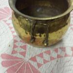 Round Brass Pot with Braded Brass Bow.  Measures 5.5".  Pre-owned & in excellent condition.  $15.00 obo