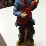 Vintage Hand Painted Guitar Player Statute.  Gorgeous Statute.  Measures 12" high.  Pre-owned & in excellent condition.  $22.00 obo