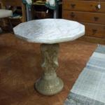 Small Table with Cherubs Pedestal.  This Table has a formica top with detailed Cherubs as the Pedestal.  Measures 18" in diameter x 19"h.  Pre-owned & in excellent condition.  $40.00 obo
