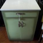 Vintage Green Metal Cabinet.  Has a laminated top.  Measures 24"l x 20"w x 36"h.  Pre-owned & in great condition.  $60.00 obo