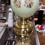 Vintage Hurricane Lamp with Round Globe.  Picture shows Globe as white, but it actually a light green.  Measures 21" high.  Pre-owned & in excellent condition.  $75.00 obo